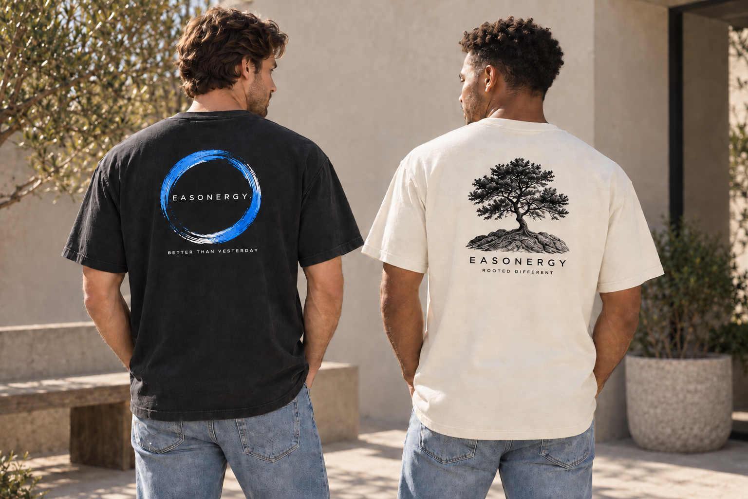 AI-generated styling preview of two adult male models wearing relaxed, boxy Main & More men’s shirts: a black shirt with the Better Than Yesterday cobalt brush-circle design and a cream shirt with the Rooted Different tree in black ink, both with compact artwork high on the back.